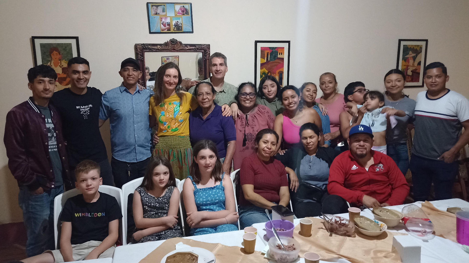 Rachel, Simon and family sharing a meal with friends in Nicaragua